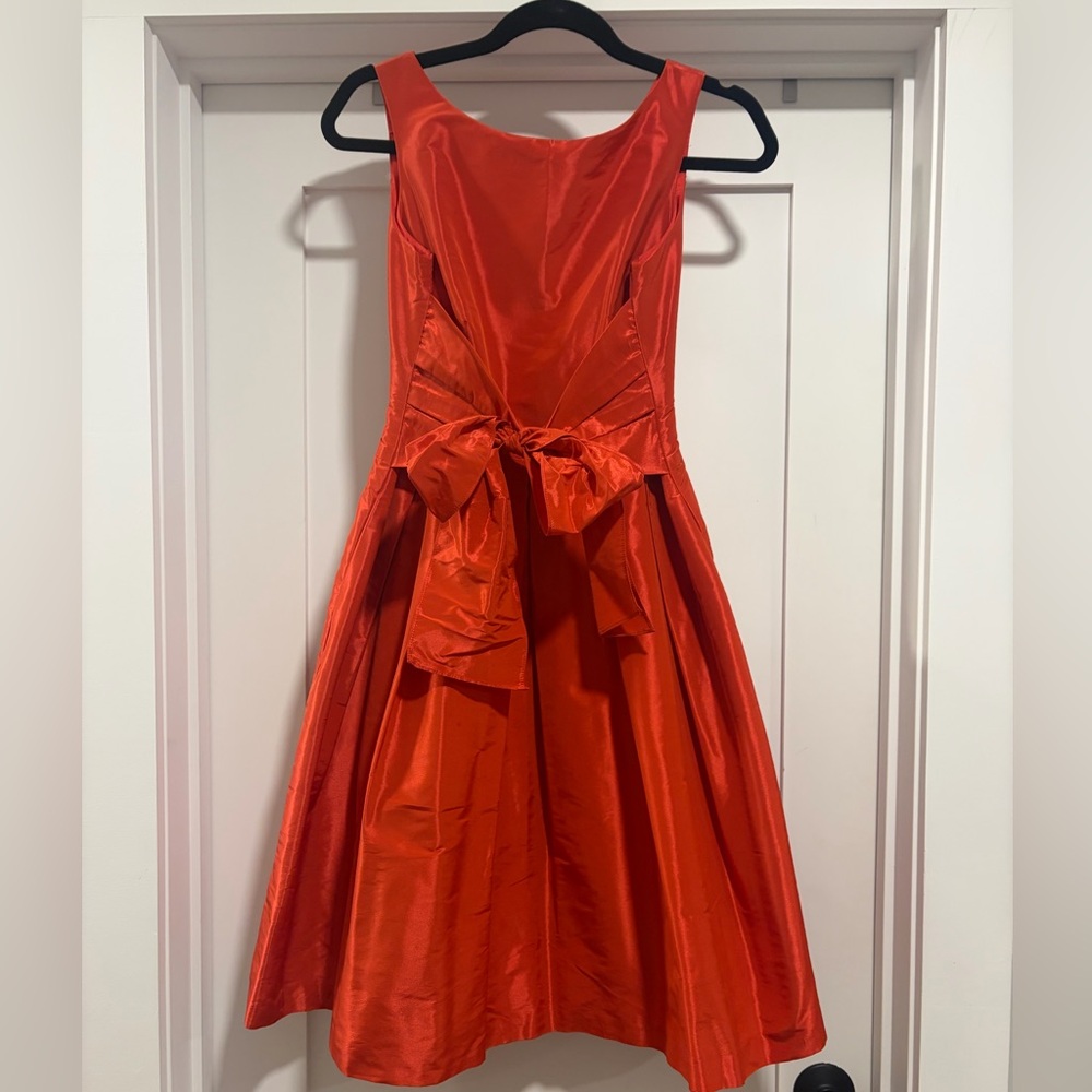 Ann Klein coral knee length dress with waist tie. Women’s Size 2